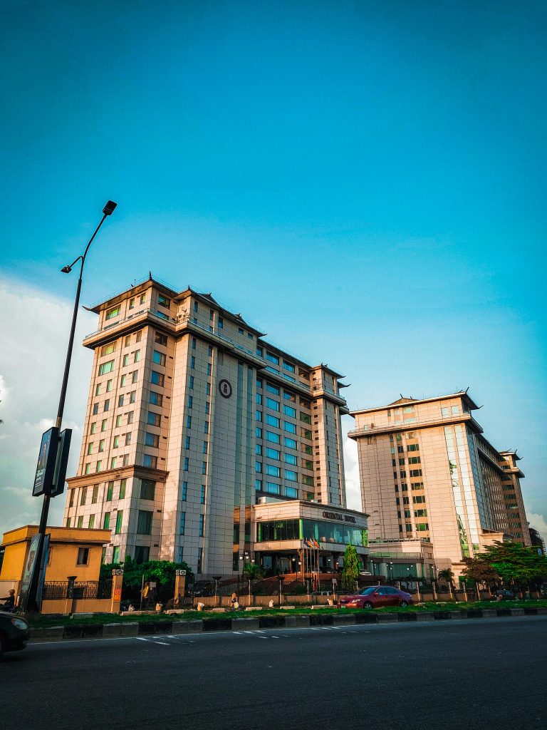 Tall hotel buildings against the vibrant Lagos city skyline.